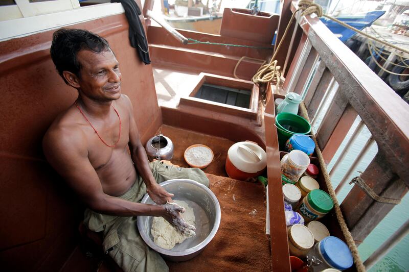 August 14, 2011 (Umm al Quwain) Naresh Bhai from, India, a deck hand onboard a Dhow makes doe while the dhow is docked off shore in Umm al Quwain August 14, 2011.  (Sammy Dallal / The National)