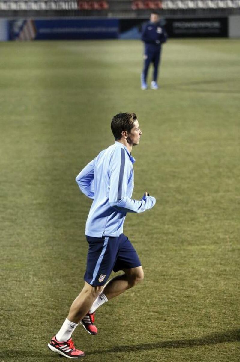 Fernando Torres practices during a training session with Atletico Madrid on Tuesday. Fernando Alvarado / EPA
