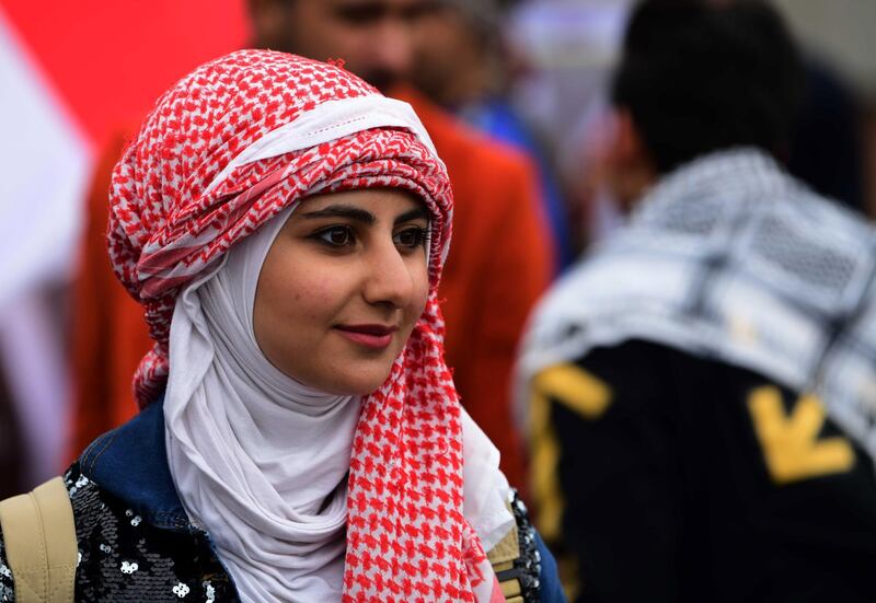A female university student takes part in a strike and protests in central Baghdad, Iraq.  EPA