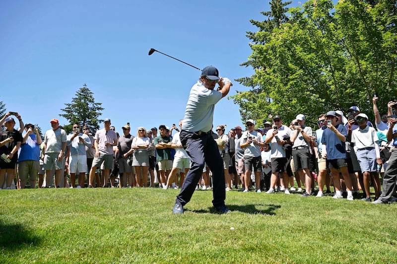 Phil Mickelson of the US plays his second shot from the rough on the second hole. EPA