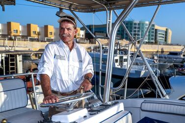 Captain Greg Heinricks, aboard his boat Reel Teezer, runs a fishing charter business in Al Bateen. Victor Besa / The National 