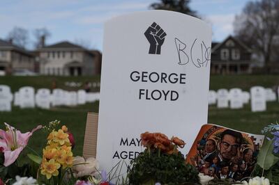 A makeshift tombstone for George Floyd near the spot where he was murdered by former police officer Derek Chauvin. Willy Lowry / The National  