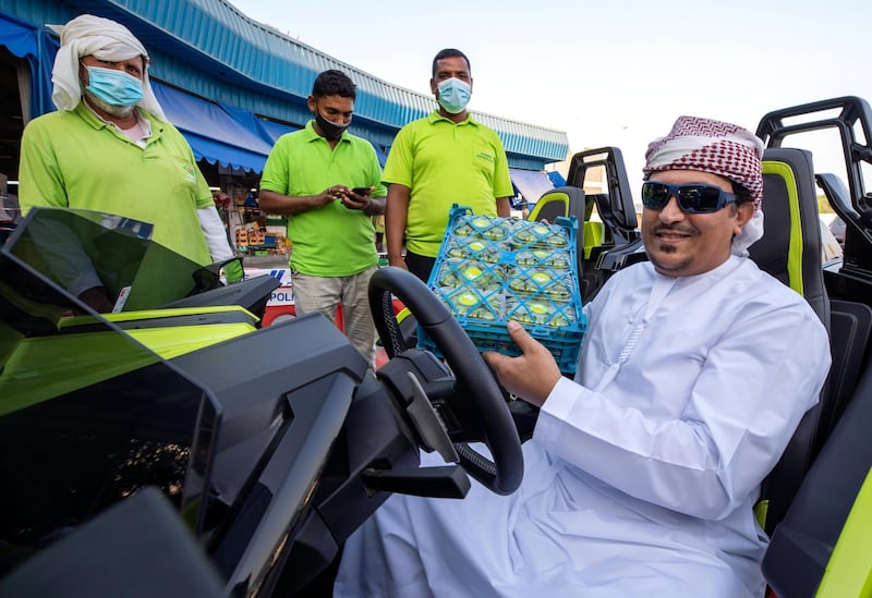 Mr. Sultan drives to the Mina Fruits and Vegetable market with Polaris Slingshot, a three-wheeled motor vehicle to buy fruits for Iftar on April 26th 2021. Victor Besa / The National.
Section: News/Standalone