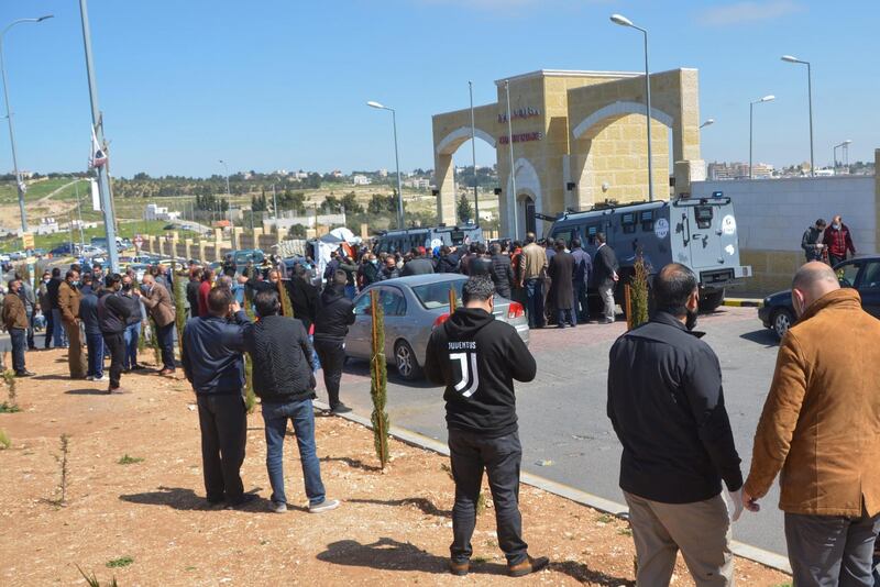 People gather outside the Al Salt government hospital after the patient deaths. Reuters