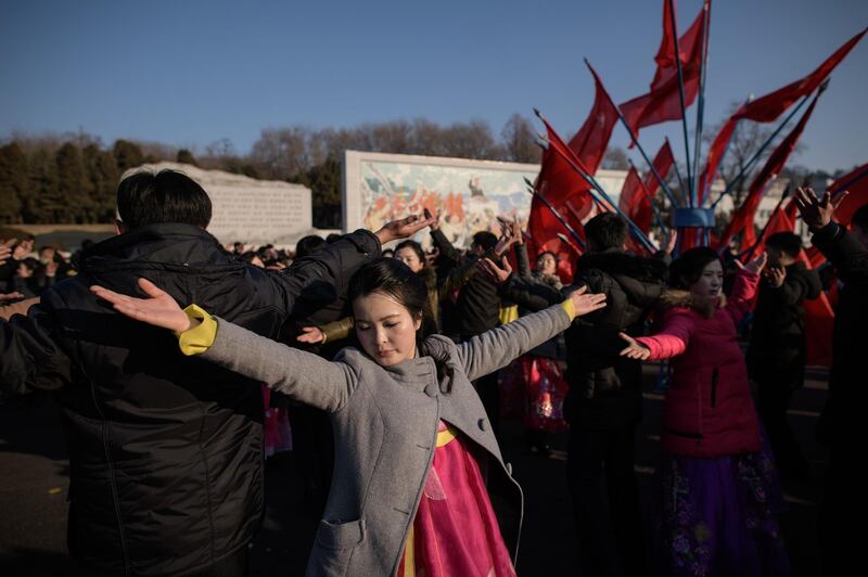 Students participate in a "mass dance" as part of celebrations marking the birthday of late North Korean leader Kim Jong Il, in Pyongyang. AFP