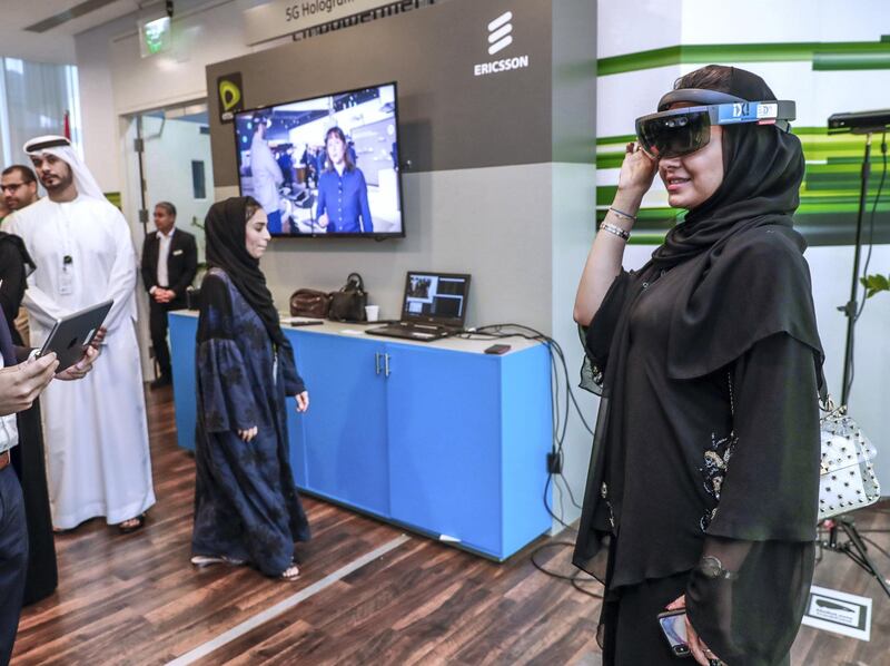 Abu Dhabi, United Arab Emirates, June 20, 2019.   5G Technology presented by Etisalat ant Ericsson.--  A visitor tries out the 5G VR headset at the Hologram Communication stand.
Victor Besa/The National
Section:  BZ
Reporter:  Sarah Townsend