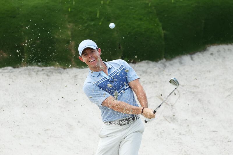 McIlroy plays a shot from a bunker on the second hole. USA Today