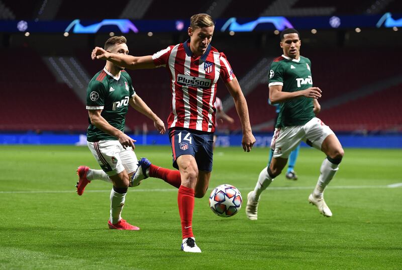 MADRID, SPAIN - NOVEMBER 25: Marcos Llorente of Atletico de Madrid shoots during the UEFA Champions League Group A stage match between Atletico Madrid and Lokomotiv Moskva at Estadio Wanda Metropolitano on November 25, 2020 in Madrid, Spain. Football Stadiums around Europe remain empty due to the Coronavirus Pandemic as Government social distancing laws prohibit fans inside venues resulting in fixtures being played behind closed doors. (Photo by Denis Doyle/Getty Images)