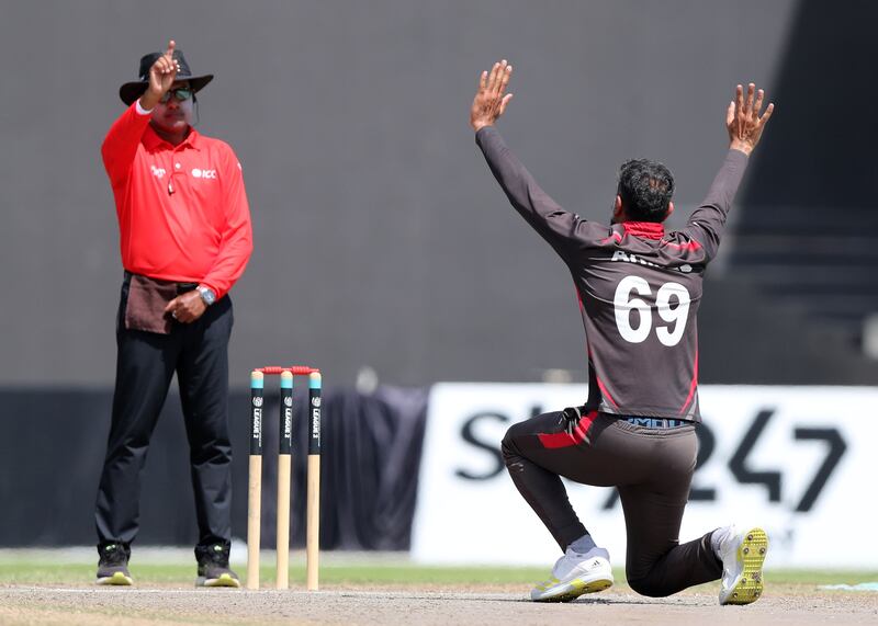 The UAE's Ahmed Raza appeals successfully for the wicket of PNG's Riley Hekure.