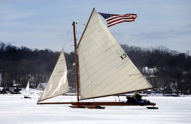 An antique iceboat flying the American flag sails on the frozen upper Hudson river near Astor Point in Barrytown. (Mike Segar / Reuters / March 7, 2014)
