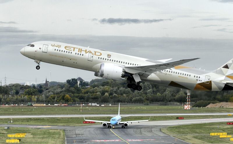 This picture shows a Boeing 787-10 Dreamliner of the Etihad airline during take-off on September 24, 2019 at the airport in Duesseldorf, western Germany. (Photo by Ina FASSBENDER / AFP)