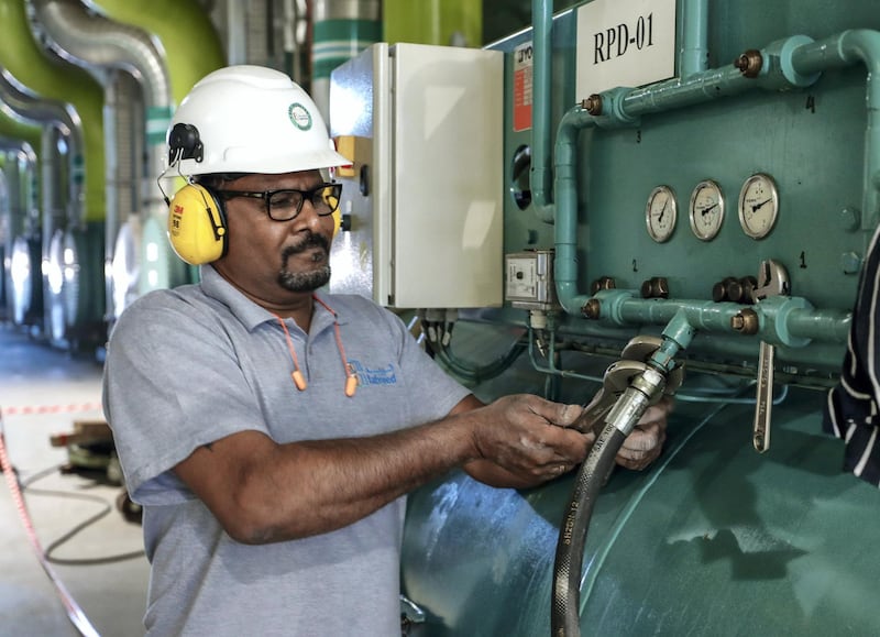 Abu Dhabi, United Arab Emirates, January 7, 2020.  
STORY BRIEF:  Tabreed media tour of  YAS Sustainable Cooling Plant 01.
--  An engineer tightens valves of a 
refrigerant refiller unit.
Victor Besa / The National
Section:  BZ
Reporter:   Fareed Rahman
