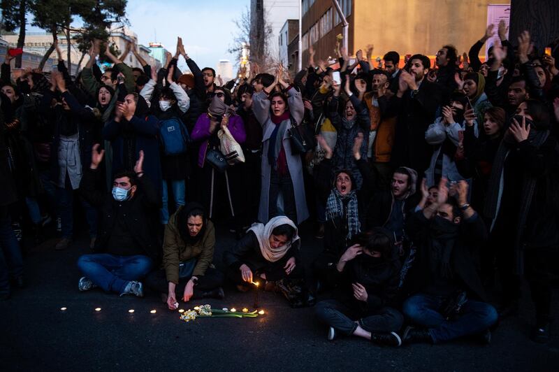 Demonstrators chant while gathering during a vigil for the victims of the Ukraine International Airlines flight that was unintentionally shot down by Iran, in Tehran, Iran. Bloomberg