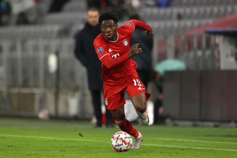 MUNICH, GERMANY - DECEMBER 09: Alphonso Davies of FC Bayern MÃ¼nchen runs with the ball during the UEFA Champions League Group A stage match between FC Bayern Muenchen and Lokomotiv Moskva at Allianz Arena on December 09, 2020 in Munich, Germany. (Photo by Alexander Hassenstein/Getty Images)