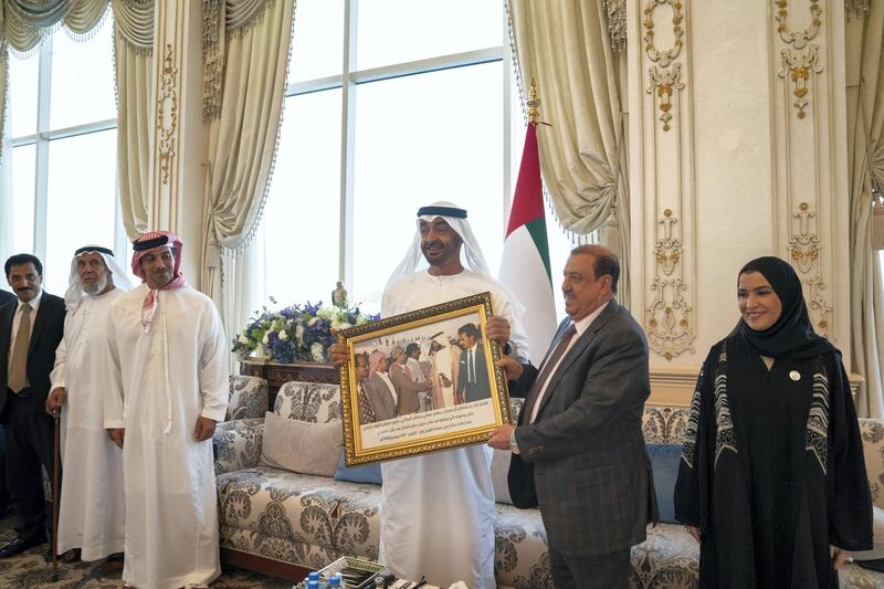 ABU DHABI, UNITED ARAB EMIRATES - July 15, 2019: HH Sheikh Mohamed bin Zayed Al Nahyan, Crown Prince of Abu Dhabi and Deputy Supreme Commander of the UAE Armed Forces (3rd R), receives a gift of a framed photograph from Sultan Al Burkani, Speaker of the Yemeni Parliament (2nd R), during a Sea Palace barza. Seen with HH Sheikh Mansour bin Zayed Al Nahyan, UAE Deputy Prime Minister and Minister of Presidential Affairs (4th R) and HE Dr Amal Abdullah Al Qubaisi, Speaker of the Federal National Council (FNC) (R).

( Mohamed Al Hammadi / Ministry of Presidential Affairs )
---