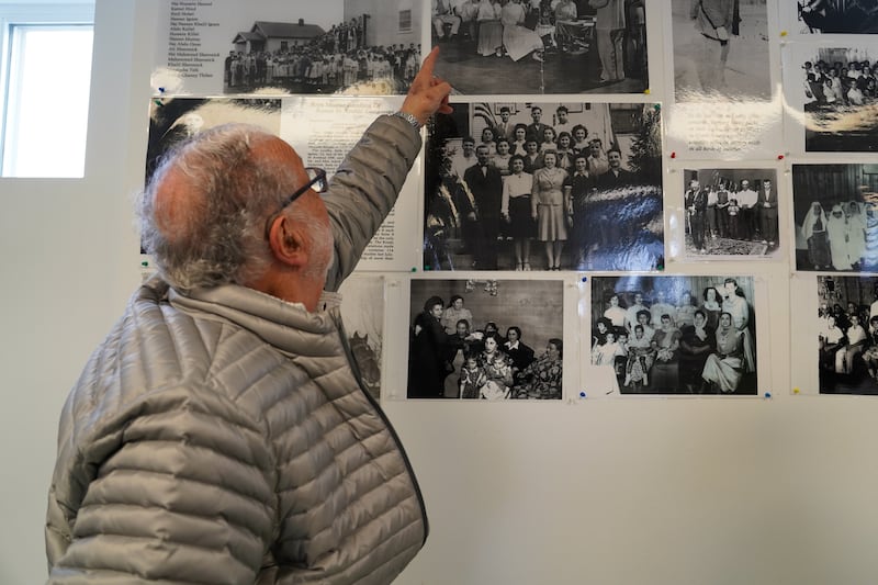 Albert Aossey points to a photo showing his family gathered inside the Mother Mosque of America in the 1940s. All photos: Willy Lowry / The National