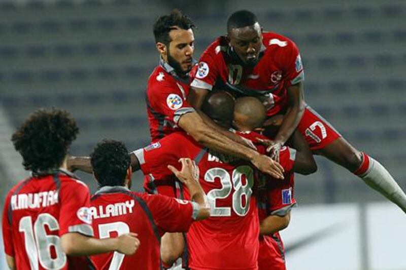 Lekhwiya players celebrate scoring against Al Nasr in the 2012 Asian Champions League.