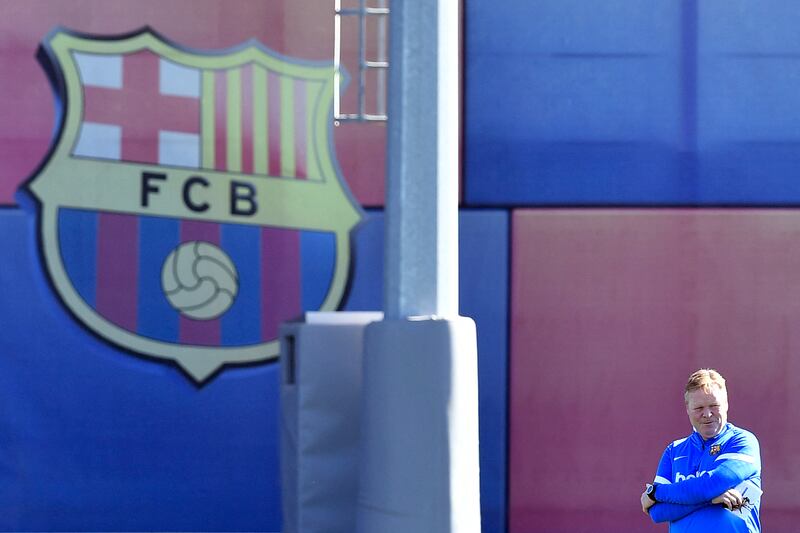 Barcelona's Dutch coach Ronald Koeman heads a training session.  AFP