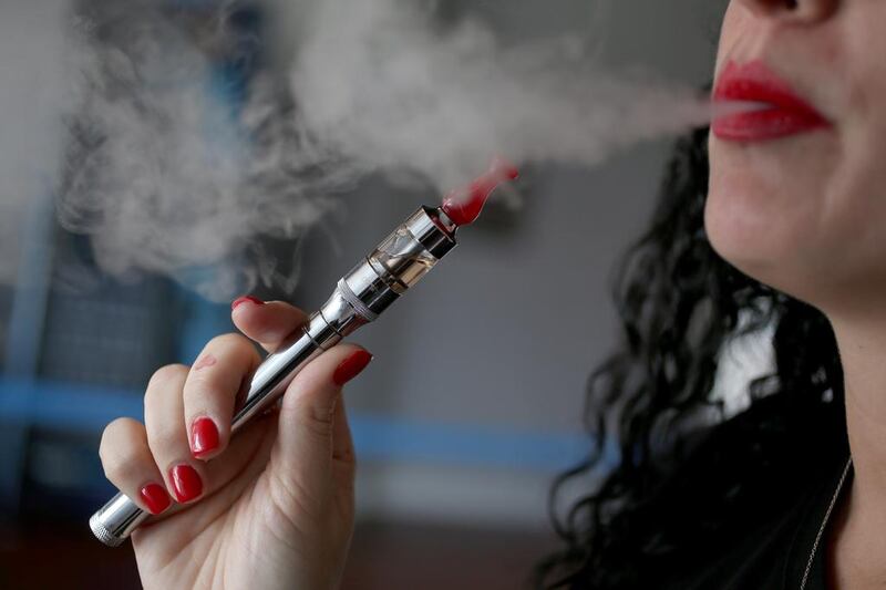 E-cigarettes are banned in the UAE but some doctors say that they are a safer alternative to smoking normal cigarettes. Getty Images / AFP