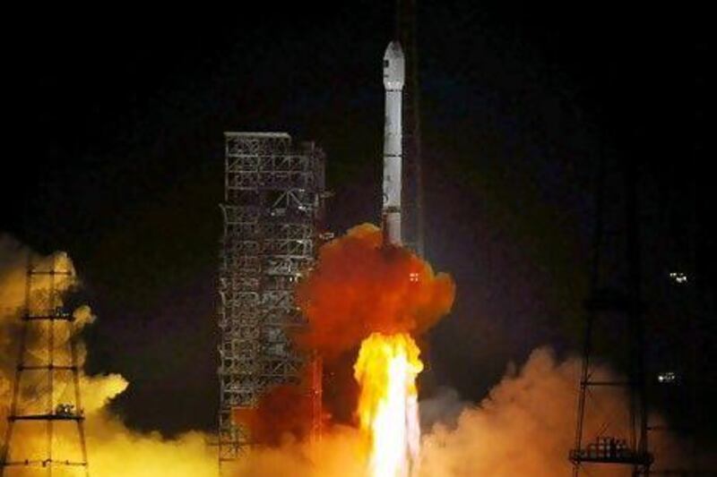 China's Long March rocket takes off, carrying Paksat-1R. Sun Zifa / Color China Photo / AP Images