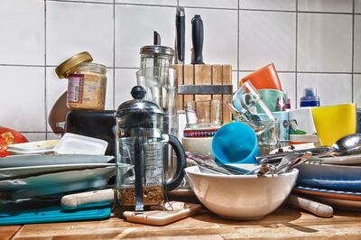 dirty dishes on a kitchen table. Getty Images