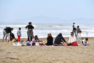 People enjoy a Sunday at the beach in Castiglione della Pescaia, Italy, a scene that could be replicated across the EU zone with the lifting of travel restrictions. Reuters