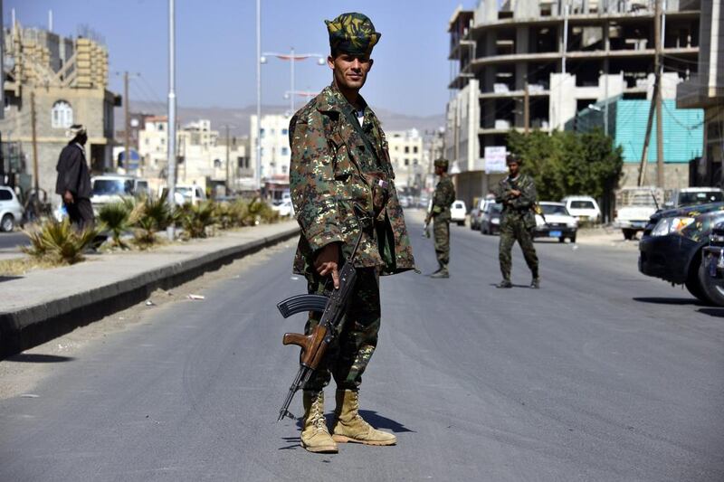 Yemeni soldiers stand guard in a street amid strict security measures in Sanaa on 23 February 2014 after authorities imposed strict security measures amid a continuing Al Qaeda insurgency and factional power struggles. Yahya Arhab / EPA 