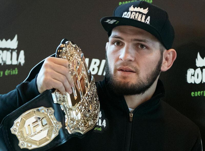 FILE - In this file photo dated Monday, Nov. 26, 2018, UFC lightweight champion Khabib Nurmagomedov holds the trophy belt during a news conference in Moscow, Russia. Khabib Nurmagomedov said Tuesday April 2, 2019, he doesnâ€™t think Conor McGregorâ€™s retirement is for real, adding, â€œI donâ€™t think heâ€™s finished.â€ (AP Photo/Pavel Golovkin, FILE)