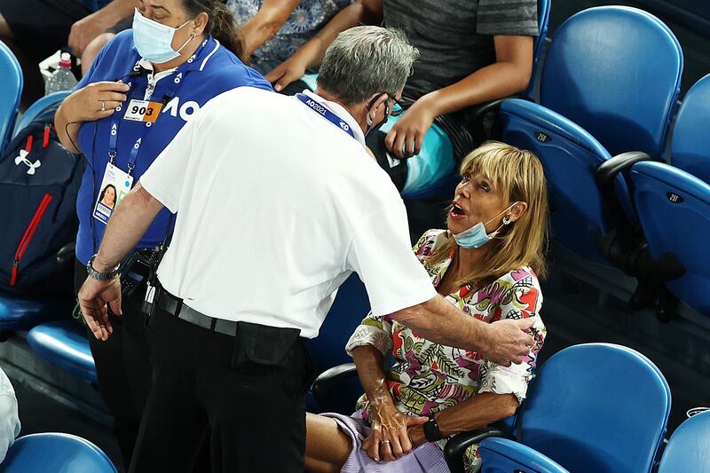 A women is removed from the arena during yesterday's game. Getty
