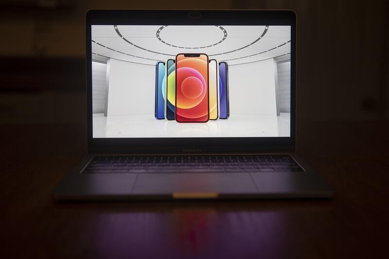 The Apple iPhone 12 is unveiled during a virtual product launch seen on a laptop computer in Tiskilwa, Illinois, U.S.  Bloomberg