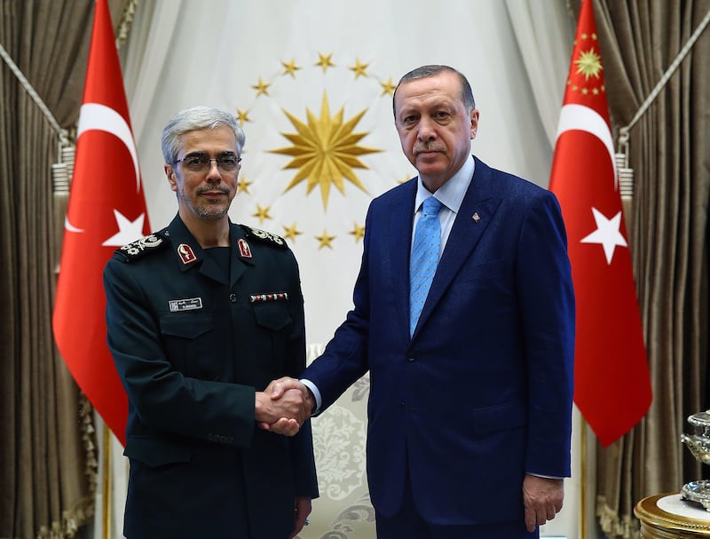 epa06147442 A handout photo made available by the Turkish President Press Office shows Turkish President Recep Tayyip Erdogan (R) with Iran's Major General Mohammad Bagheri (L) as they shake hands during their meeting in Ankara, Turkey, 16 August 2017.  EPA/TURKISH PRESIDENT PRESS OFFICE HANDOUT  HANDOUT EDITORIAL USE ONLY/NO SALES