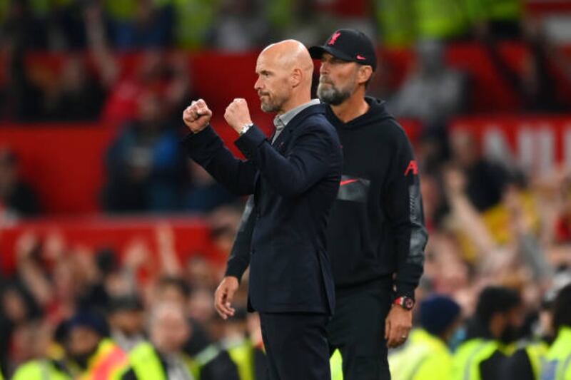 United manager Erik ten Hag celebrates victory as Liverpool's Jurgen Klopp stands by. Getty