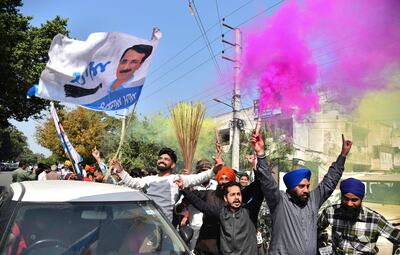Aam Aadmi Party supporters celebrate in Amritsar, India after poll trends in Punjab showed a resounding win for the party. AP Photo