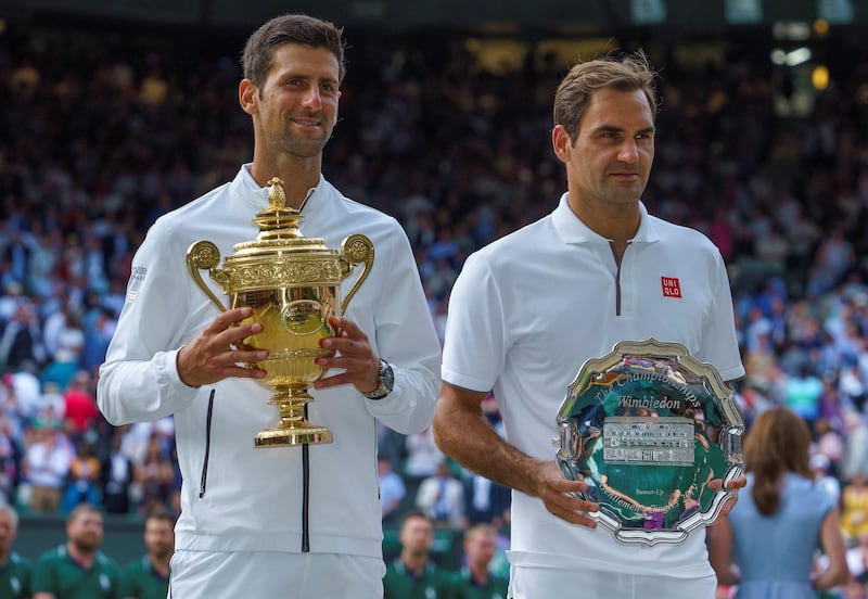 FILE PHOTO: Jul 14, 2019; London, United Kingdom; Novak Djokovic (SRB) poses with Roger Federer (SUI) after the mens final on day 13 at the All England Lawn and Croquet Club. Mandatory Credit: Susan Mullane-USA TODAY Sports/File Photo