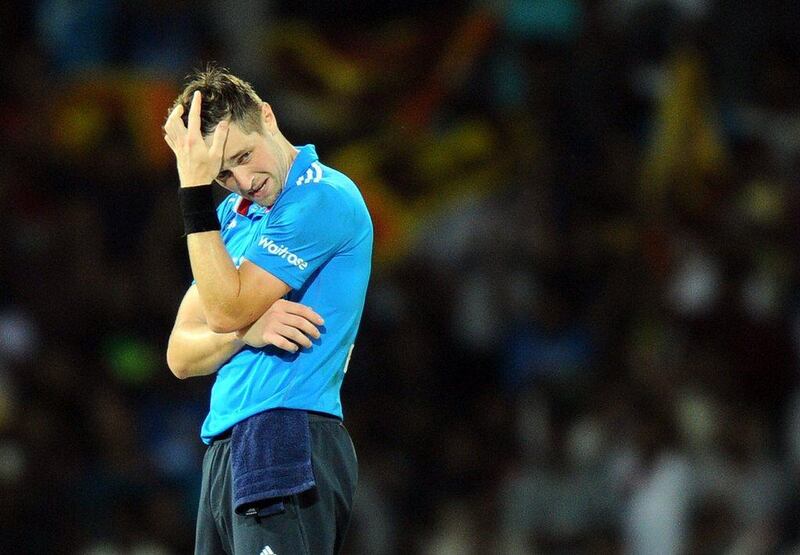 England bowler Chris Woakes reacts after a boundary during his side's ODI loss to Sri Lanka on Sunday in Colombo. Ishara S Kodikara / AFP / December 7, 2014