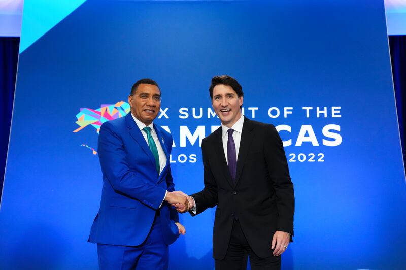 Canadian Prime Minister Justin Trudeau meets Jamaican Prime Minister Andrew Holness at the Summit of the Americas. AP