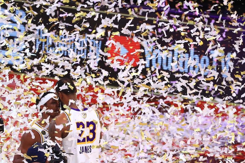 Lakers' LeBron James hugs Rajon Rondo. AFP