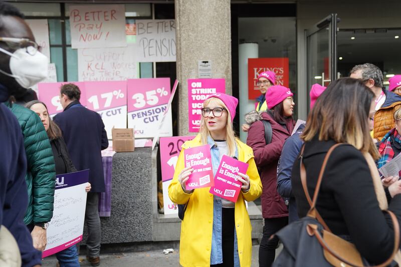 Lecturers join the picket line outside King's College London. PA