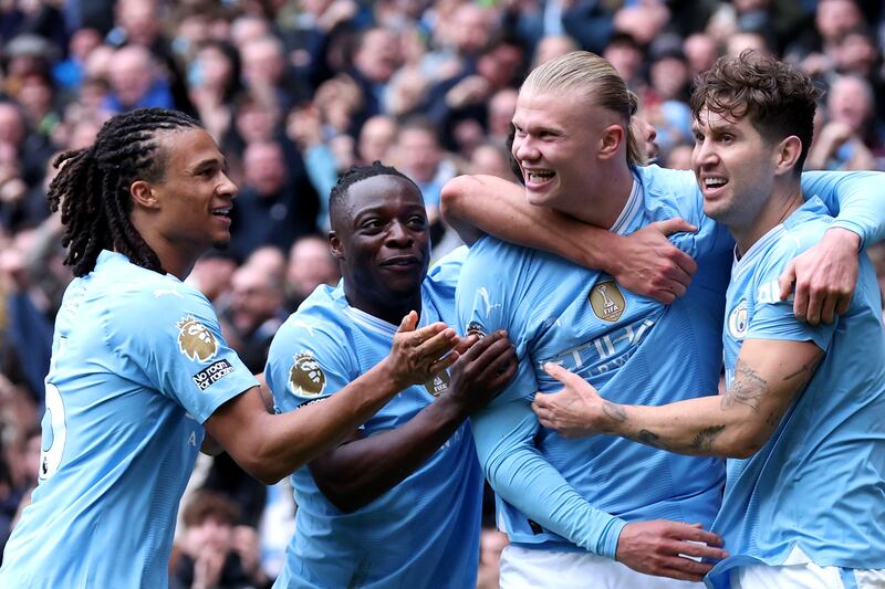 Erling Haaland of Manchester City celebrates with teammates after scoring his team's opening goal against Everton. Getty Images