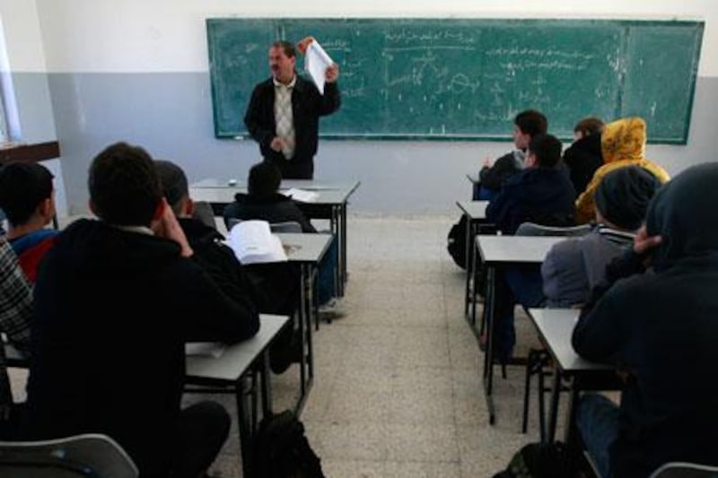 Palestinian students attend class on Sunday in Ramallah. A US-funded study released on Monday said both Israeli and Palestinian school books largely present one-sided narratives of the conflict between the two peoples and tend to ignore the existence of the other side, but rarely resort to demonisation. Majdi Mohammed / AP Photo