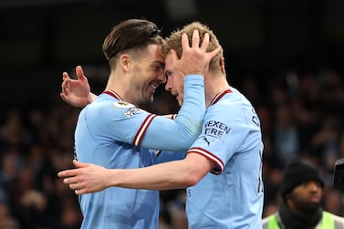 MANCHESTER, ENGLAND - APRIL 26: Kevin De Bruyne of Manchester City celebrates with teammate Jack Grealish after scoring the team's third goal during the Premier League match between Manchester City and Arsenal FC at Etihad Stadium on April 26, 2023 in Manchester, England. (Photo by Catherine Ivill / Getty Images)