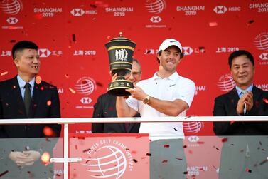 Rory McIlroy is presented with the trophy after his playoff victory at the WGC-HSBC Champions in Shanghai. Getty