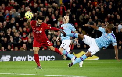 Soccer Football - Premier League - Liverpool v Manchester City - Anfield, Liverpool, Britain - November 10, 2019  Liverpool's Mohamed Salah scores their second goal   Action Images via Reuters/Carl Recine  EDITORIAL USE ONLY. No use with unauthorized audio, video, data, fixture lists, club/league logos or "live" services. Online in-match use limited to 75 images, no video emulation. No use in betting, games or single club/league/player publications.  Please contact your account representative for further details.     TPX IMAGES OF THE DAY