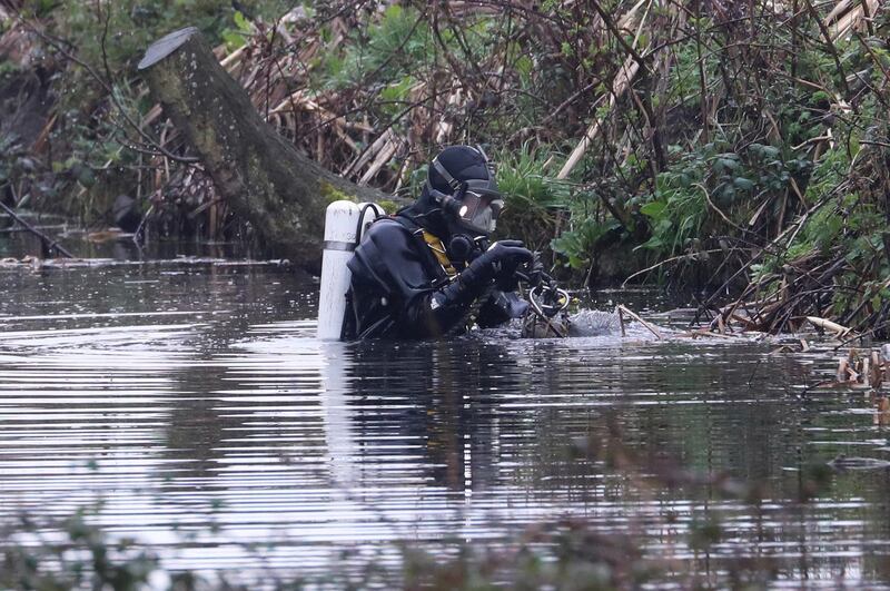 Police divers search a waterway in Sandwich, southern England. AP Photo