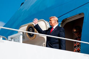 Former US president Donald Trump steps off Air Force One as he arrives at Palm Beach International Airport on January 20. Before leaving the White House, Mr Trump signed a proclamation that exempts the UAE from a 10 per cent tariff imposed by his administration in 2018 on metals imports. AFP.