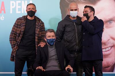 Former Barcelona goalkeeping coach Juan Carlos Unzue, who from suffers amyotrophic lateral sclerosis, with Spain manager Luis Enrique, left, Manchester City manager Pep Guardiola, second right, and Barca head coach Xavi. EPA 