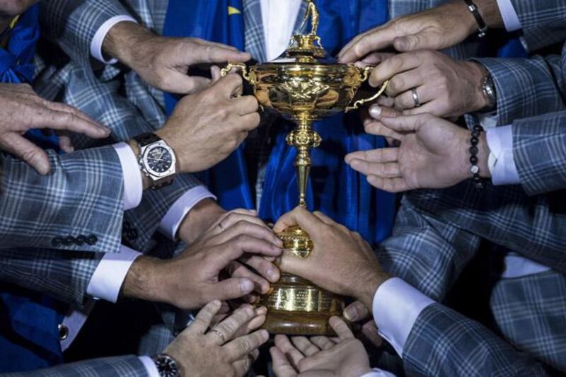 Members of Team Europe hold the Ryder Cup after the final day of the 39th Ryder Cup at the Medinah Country Club September 30, 2012 in Medinah, Illinois. Europe produced the greatest comeback in Ryder Cup history to reel in the United States and retain the trophy.  AFP PHOTO/Brendan SMIALOWSKI

