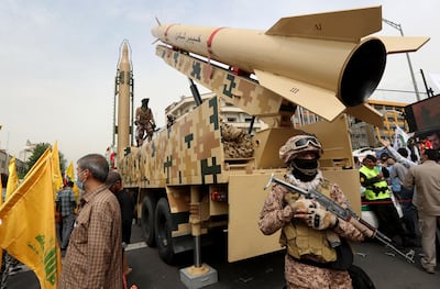 Iranian soldiers stand next to Kheibar (right) and Shahab-3 (left) missiles during a rally Tehran in 2022. Modern Iranian missiles can hit targets within metres. AFP
