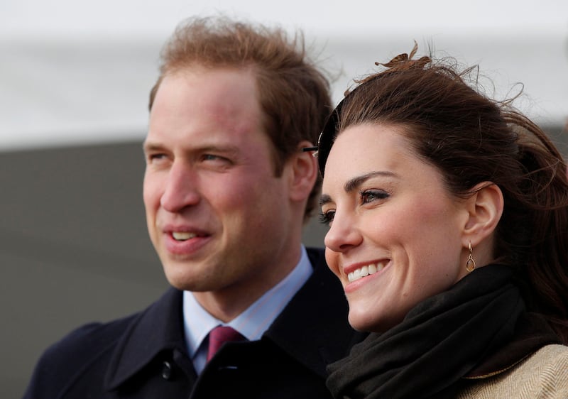Kate Middleton and Prince William visit Trearddur Bay lifeboat station in Anglesey, Wales, in February 2011, after their engagement in November 2010