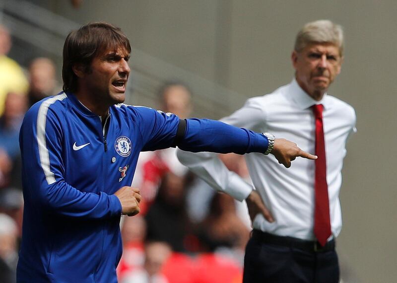Chelsea's team manager Antonio Conte, left, gestures beside Arsenal manager Arsene Wenger during the English Community Shield soccer match between Arsenal and Chelsea at Wembley Stadium in London, Sunday, Aug. 6, 2017. (AP Photo/Frank Augstein)